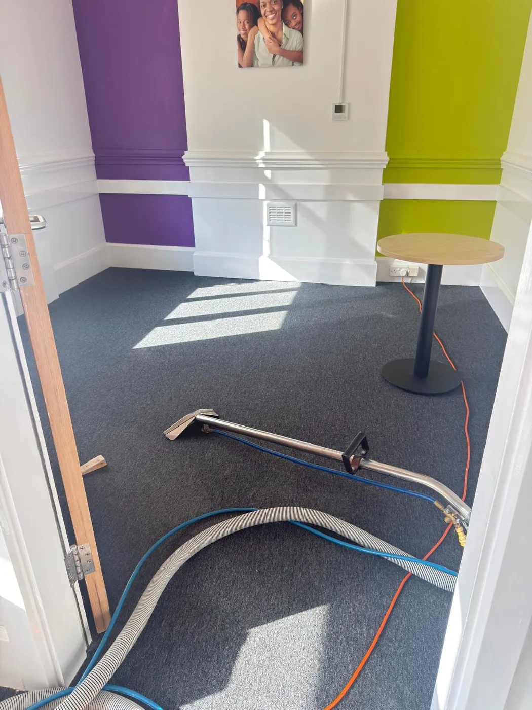 Carpet cleaning in progress in a Peterborough office using hot water extraction