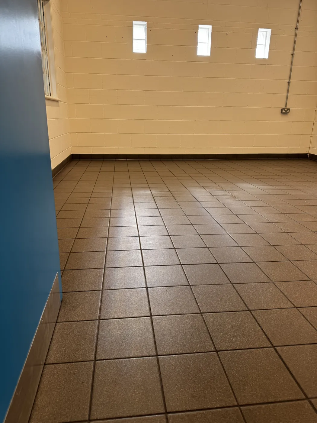 Tiled commercial floor cleaned and buffed