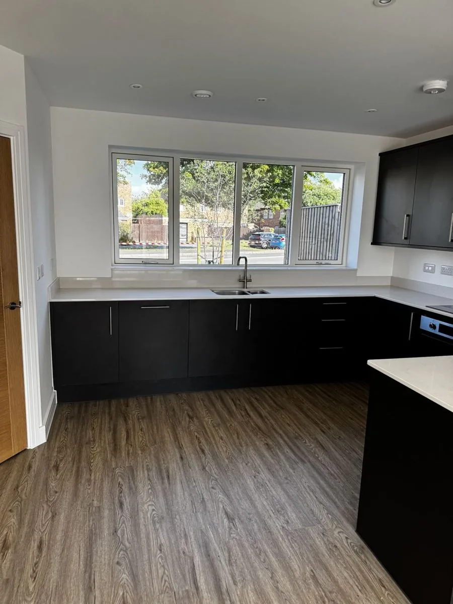 New-build kitchen after an after-builders clean, ready for handover