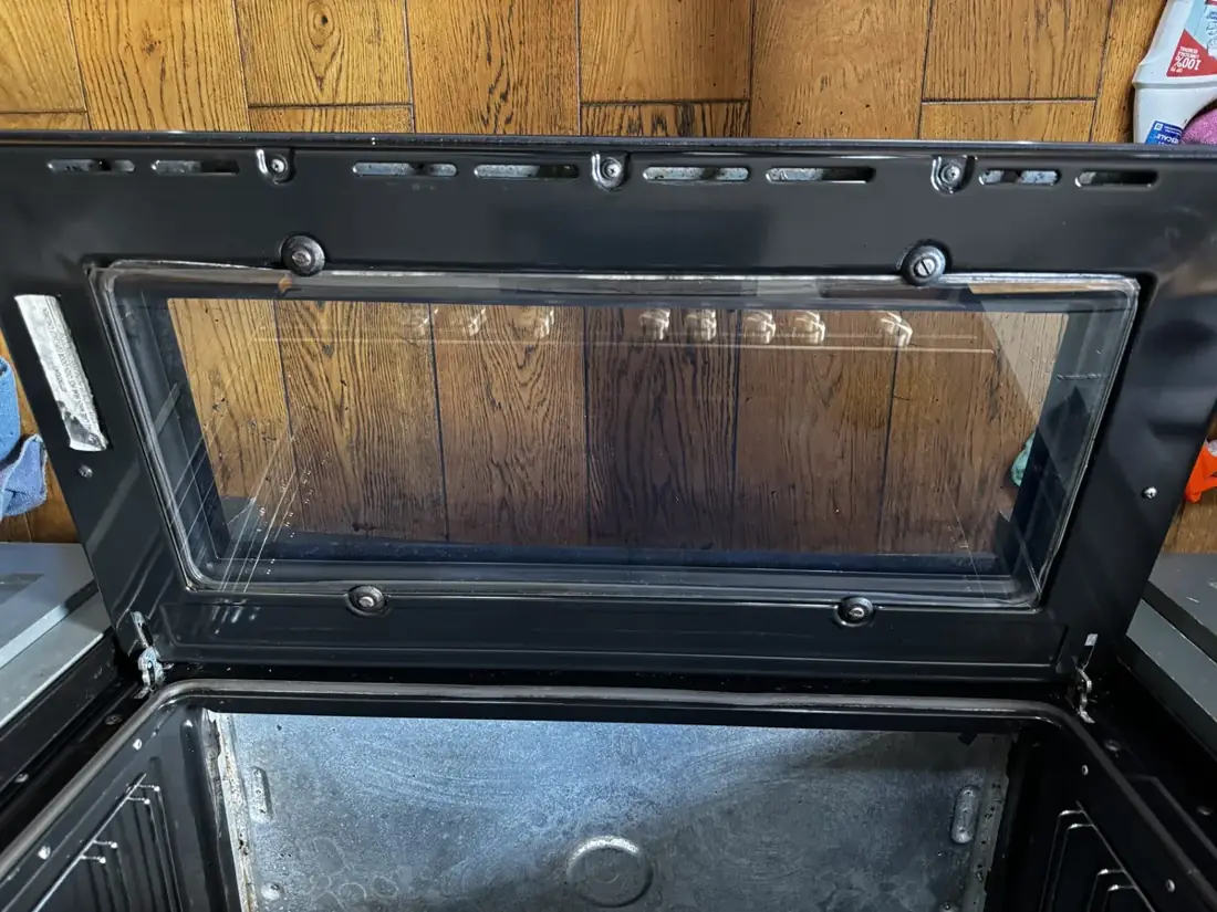 Oven door glass after cleaning, clear enough to see the floor through it