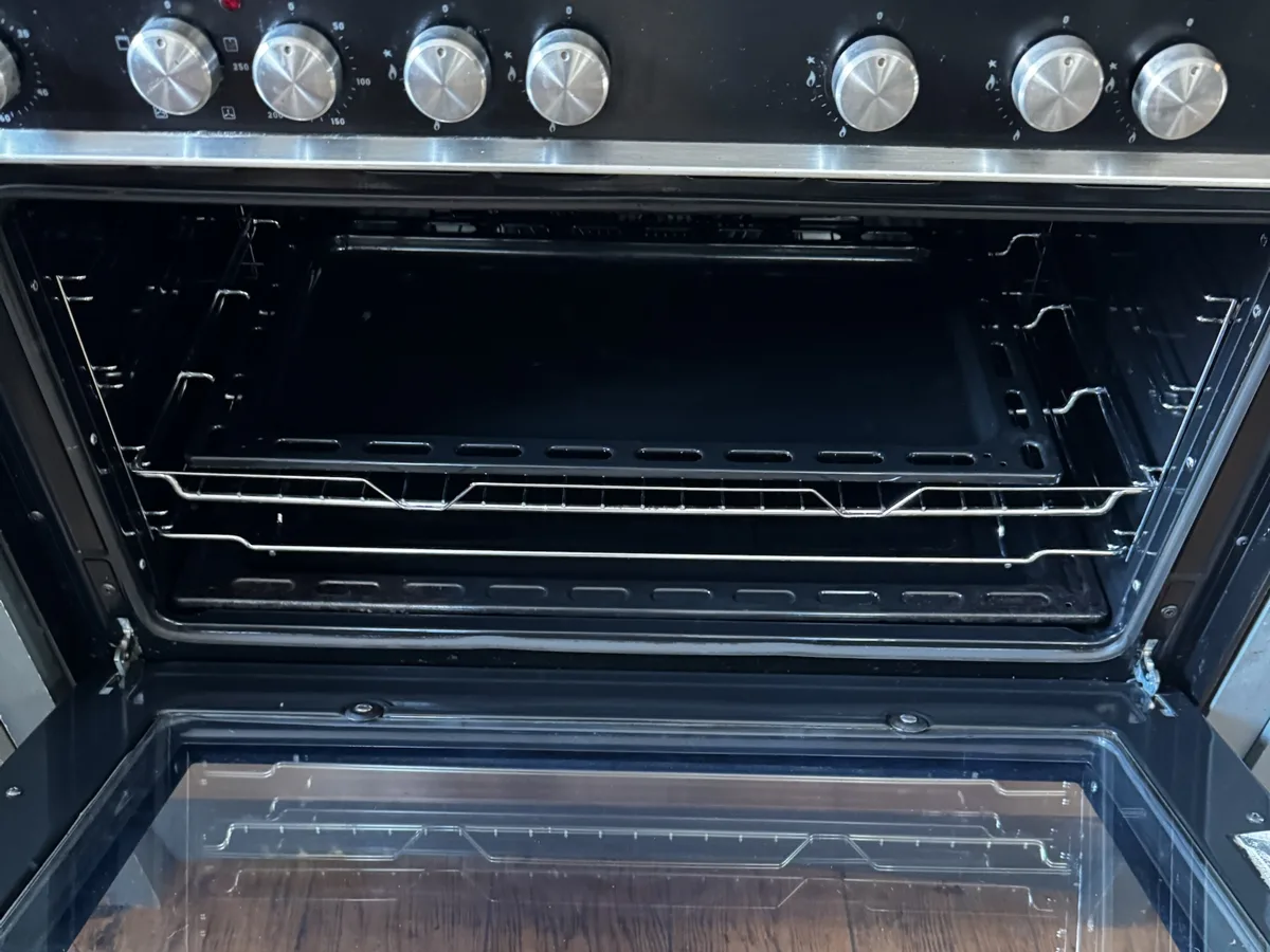 The same range cooker after cleaning, with clean racks and interior