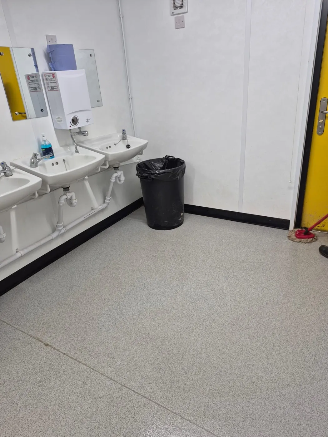 Washroom sinks and floor cleaned as part of a janitorial contract